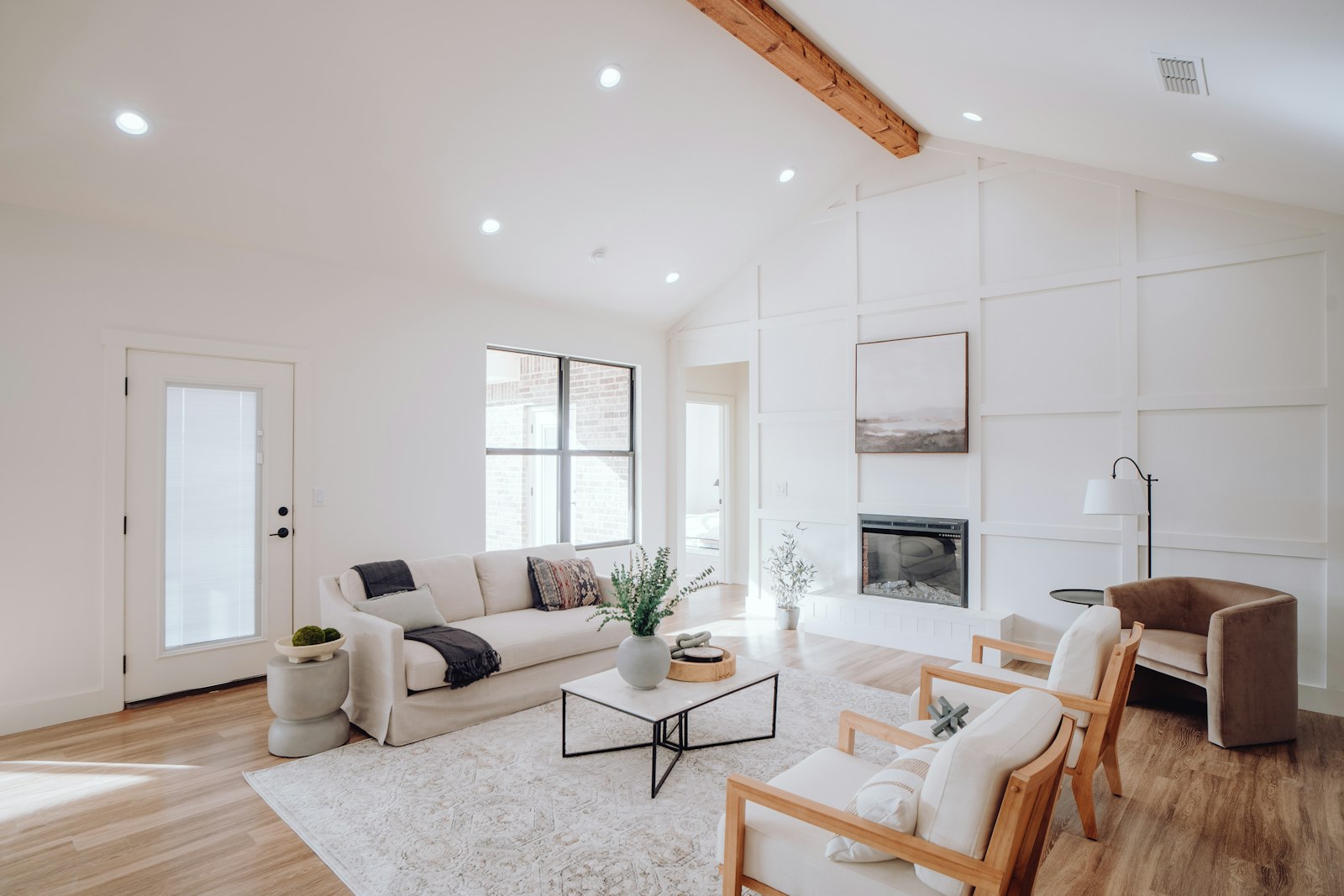 A bright, neutrally furnished living room